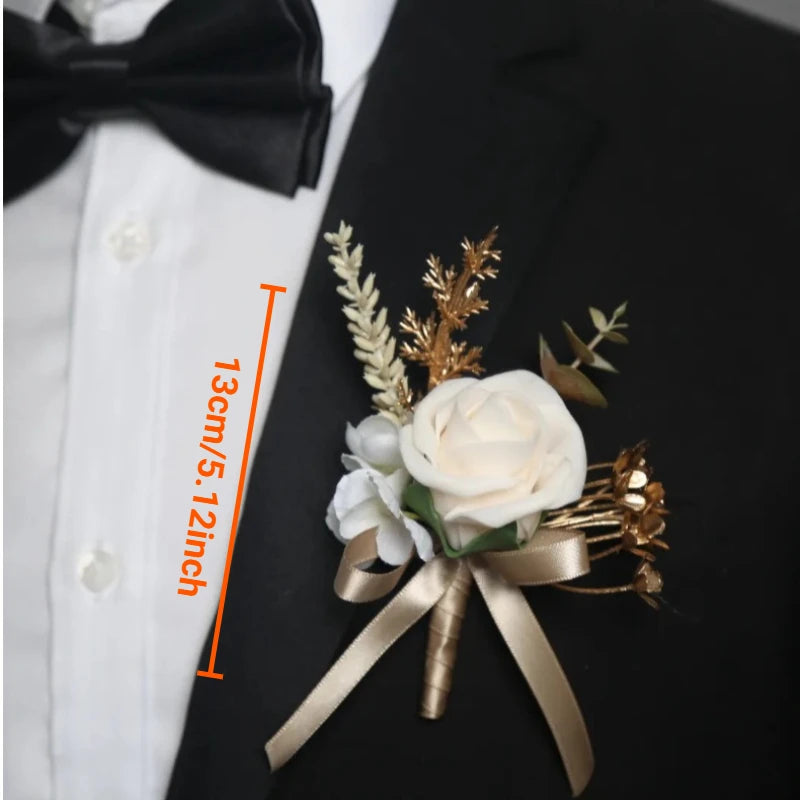 A small bouquet of white artificial roses tied with a gold ribbon on a black suit jacket.