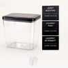 Clear plastic automatic pop-up laundry pod organizer with three labeled storage compartments for scent boosters, laundry pods