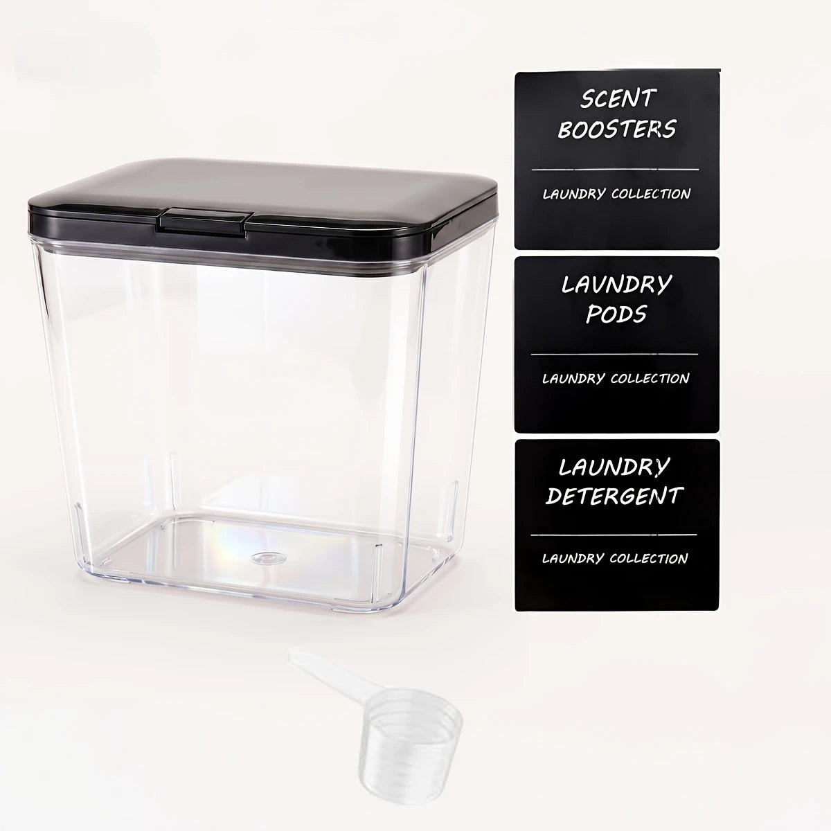 Clear plastic automatic pop-up laundry pod organizer with three labeled storage compartments for scent boosters, laundry pods