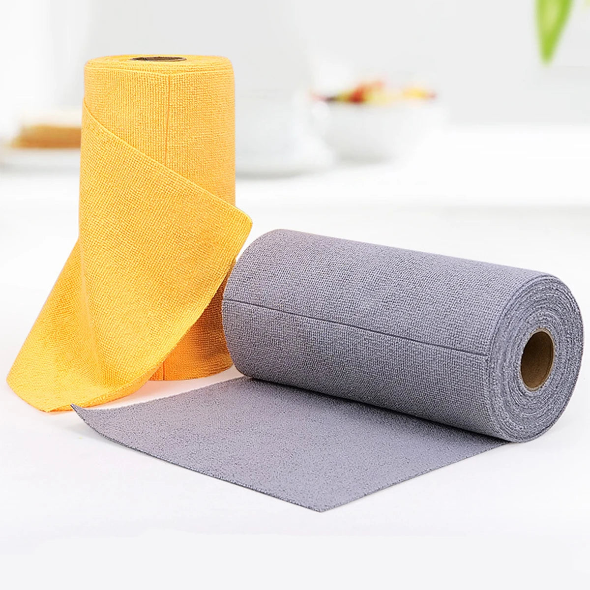 Rolls of reusable multi-surface cleaning wipes in yellow and gray colors