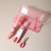 A pink silicone baby bottle cleaning set with a storage case, including a brush and a cleaning tool.