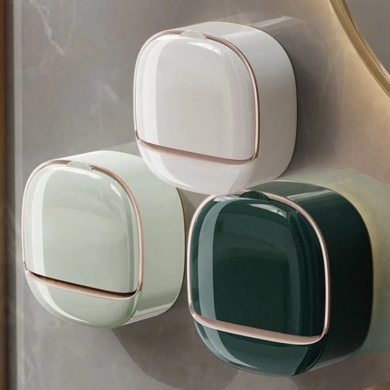 Wall-mounted soap holder with a lid in white and dark green colors
