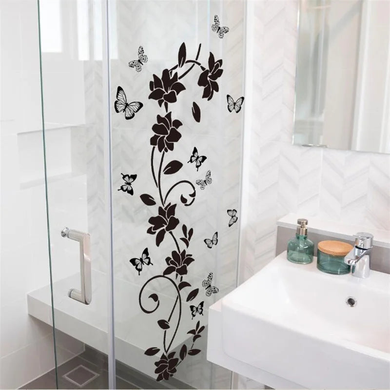 Decorative flower butterfly wall stickers on a glass shower door in a bathroom