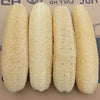 Four cylindrical natural loofah exfoliating body sponges with hanging ropes.