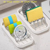 W-shaped stainless steel soap storage rack holding three colored soaps on a white tray