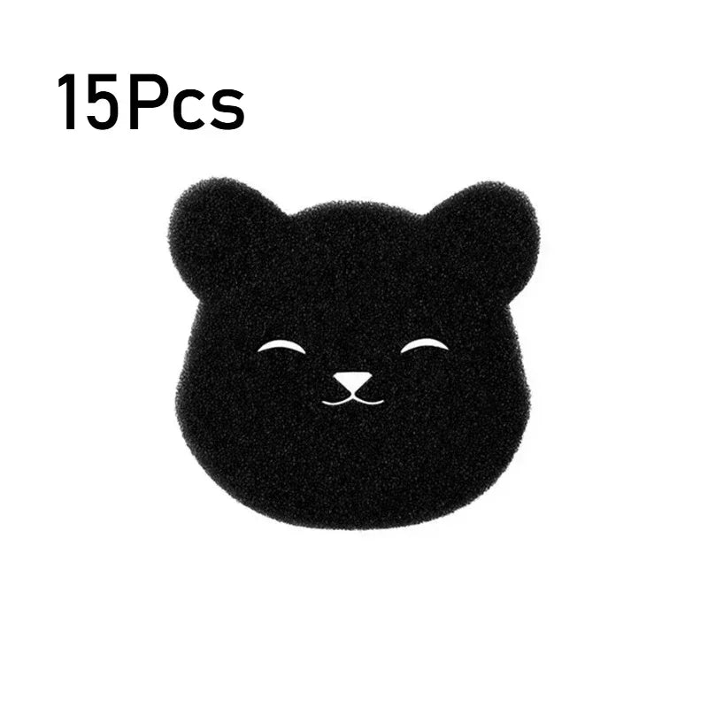 A black, fuzzy cat-shaped pet hair remover sponge.