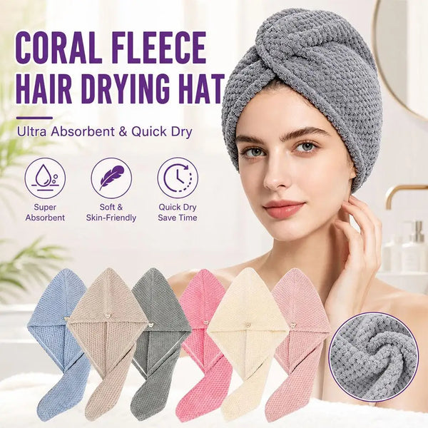A woman is wearing a gray coral fleece hair drying hat, with various colored fabric wraps displayed below.