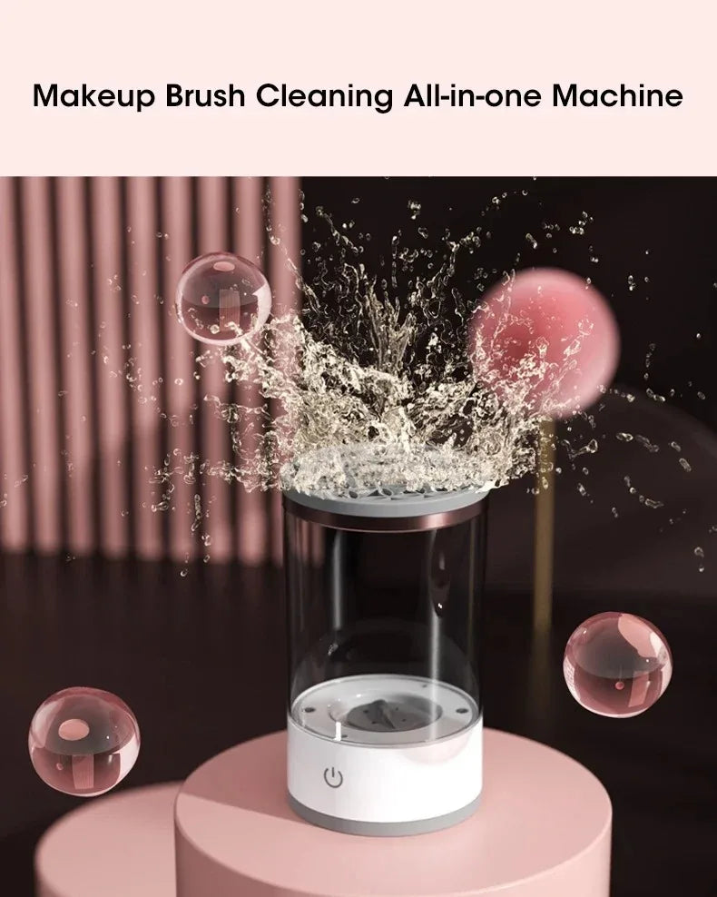 A makeup brush cleaning all-in-one machine with a clear glass container and a pink base, showing water spray.