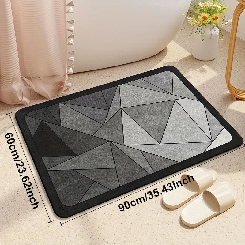 A rectangular gray and black bath mat with a geometric pattern is shown next to wooden bath mats.