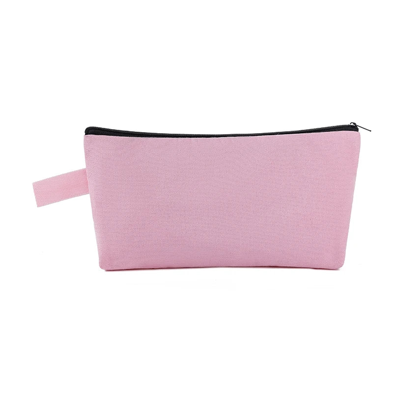 A pink zippered pouch used for storing cosmetics or stationery.