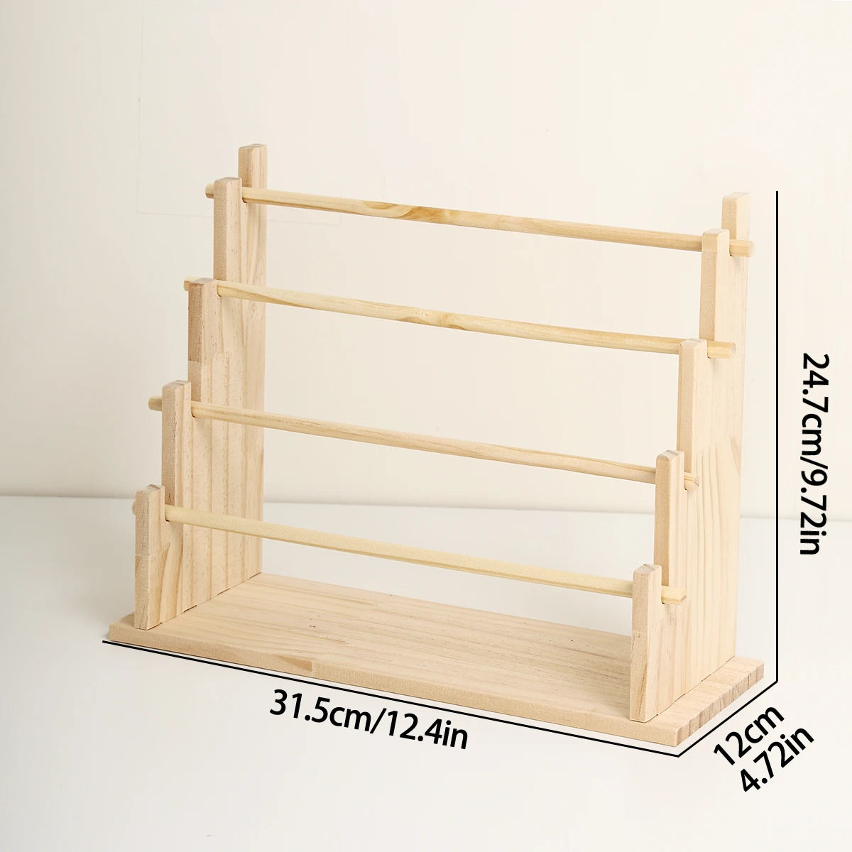 A solid wood ladder jewelry organizer with multiple tiers shown in a side view.
