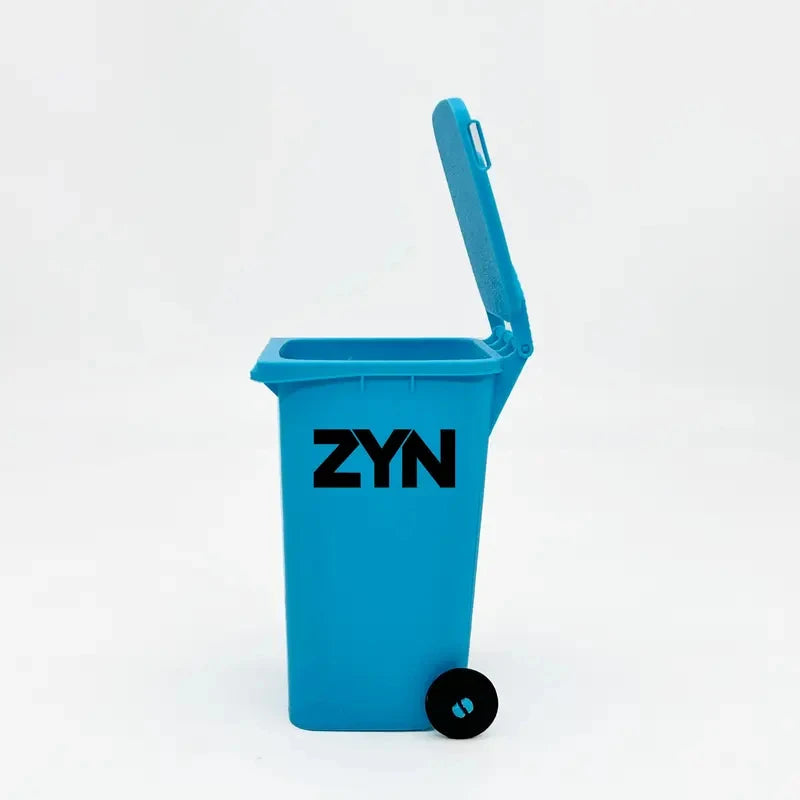 A bright blue mini desk organizer trash can with a hinged lid is shown against a white background.