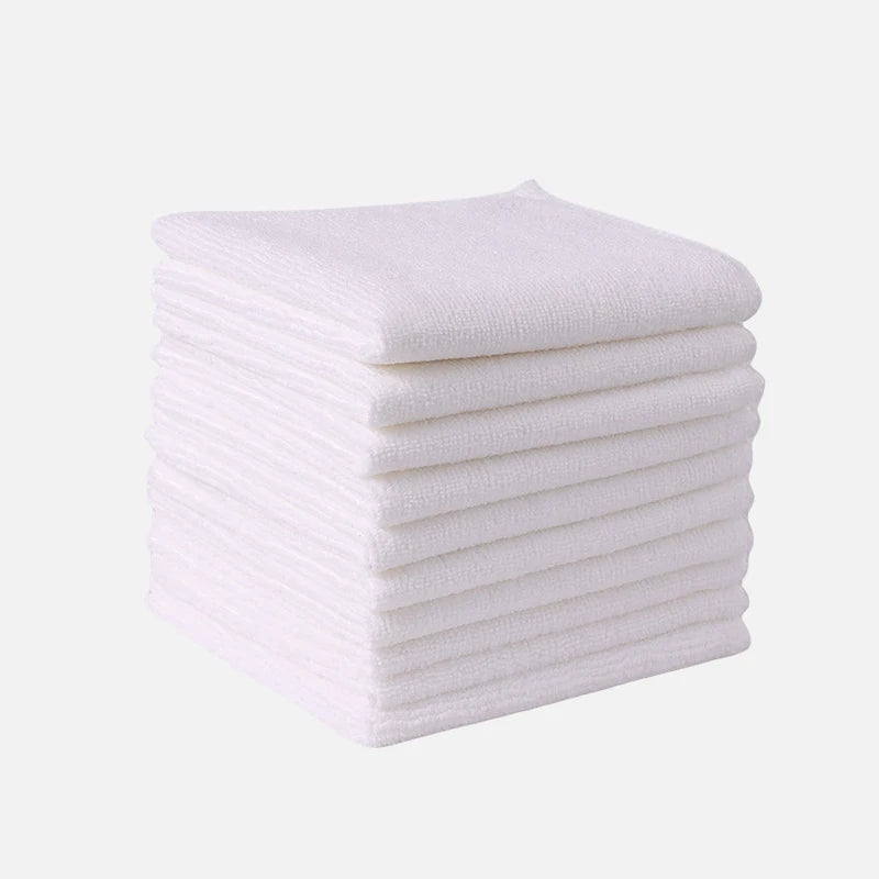A stack of white thickened microfiber cleaning cloths for glass and surfaces.