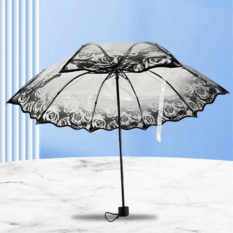A black retro transparent folding umbrella is shown open against a light blue background.
