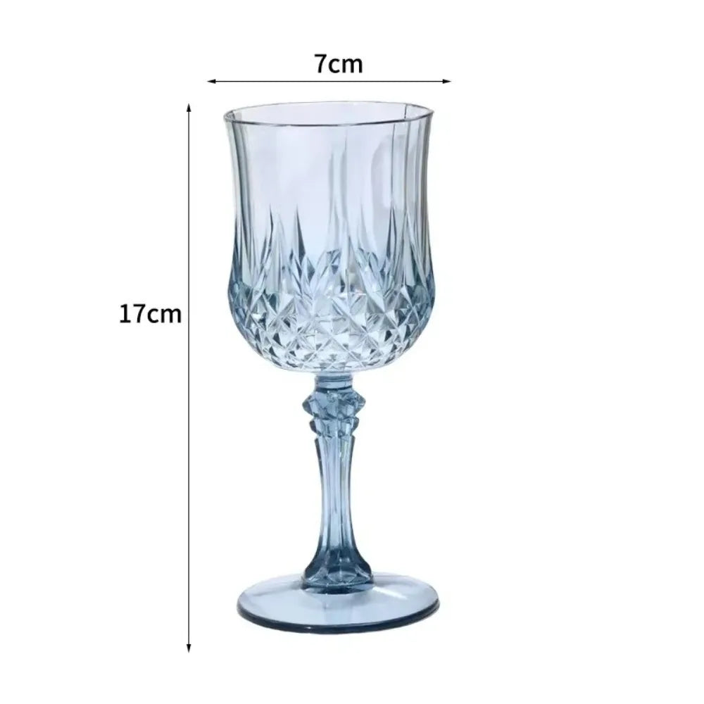 Clear glass champagne flute with a decorative cut pattern and stem