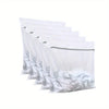 A row of clear mesh laundry bags stacked horizontally.