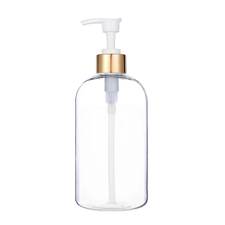 Clear glass refillable pump soap dispenser bottle with a gold-colored pump top