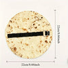 A round canvas pencil pouch featuring a burrito design and secured with a black strap.