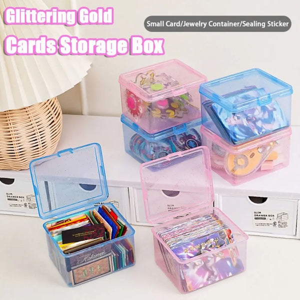 A collection of glittering gold cards stored in clear plastic storage boxes for jewelry and small items