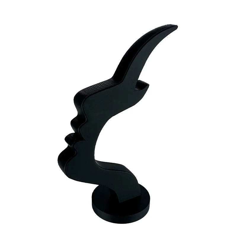 A black minimalist 3D printed profile eyeglass stand with a curved, stylized shape.