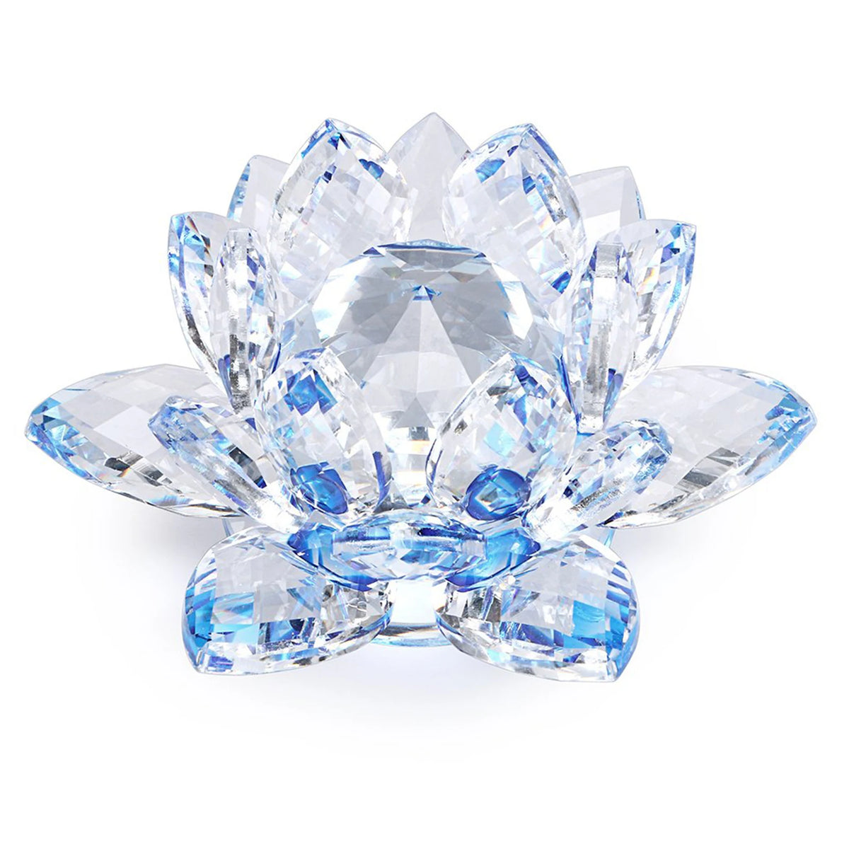 A clear crystal lotus flower centerpiece with blue accents used as tabletop decor.