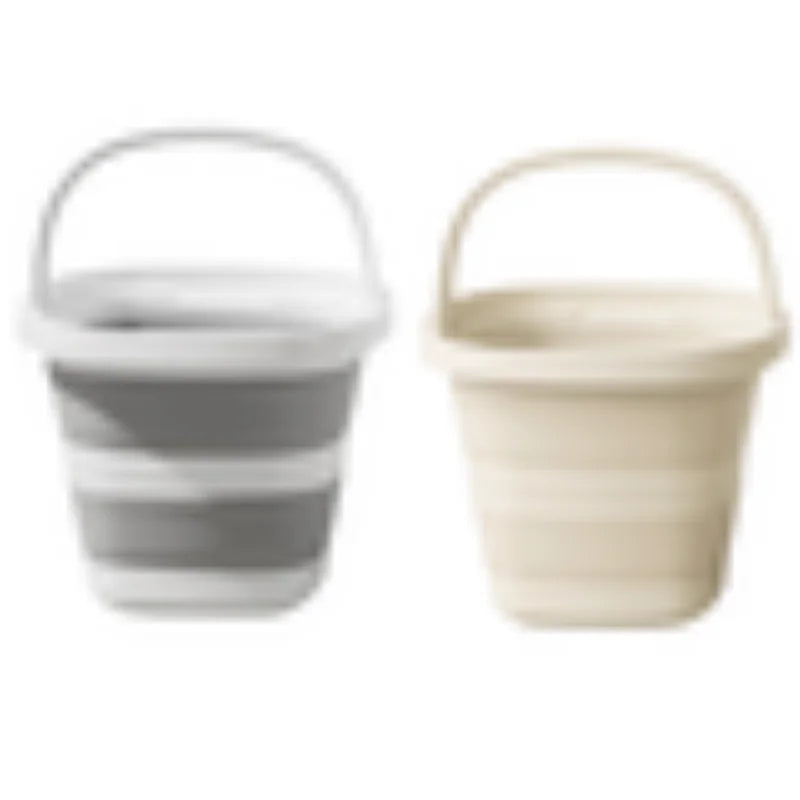 A pair of collapsible water buckets with handles, one gray and one beige.