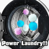 Close-up of reusable laundry balls in various colors floating in water inside a washing machine drum.
