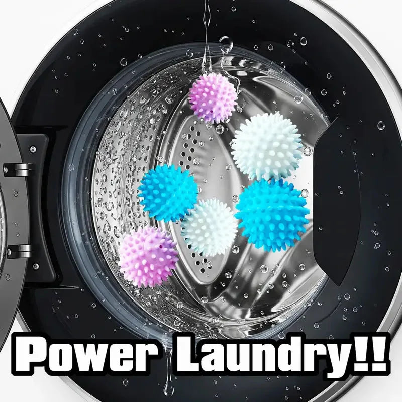 Close-up of reusable laundry balls in various colors floating in water inside a washing machine drum.