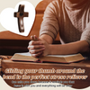 A hand rests on an open book with a wooden cross visible in the background, suggesting stress relief.