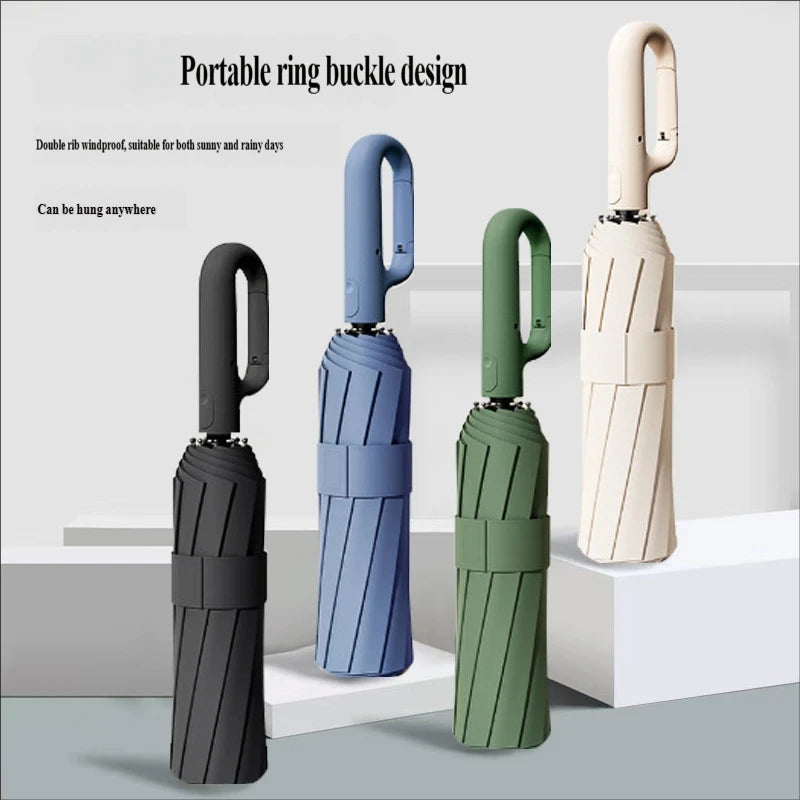 Three portable ring buckle design umbrellas in black, blue, and green colors shown standing upright.