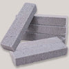 Stack of gray natural pumice stone cleaning sticks