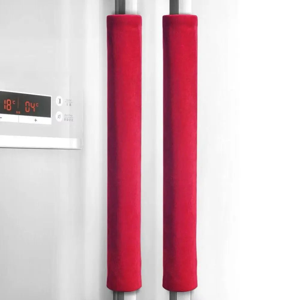 A pair of red oil-proof refrigerator handle covers hanging on a metal rod.
