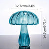 A translucent blue glass mushroom vase with a ribbed stem and dome shape.