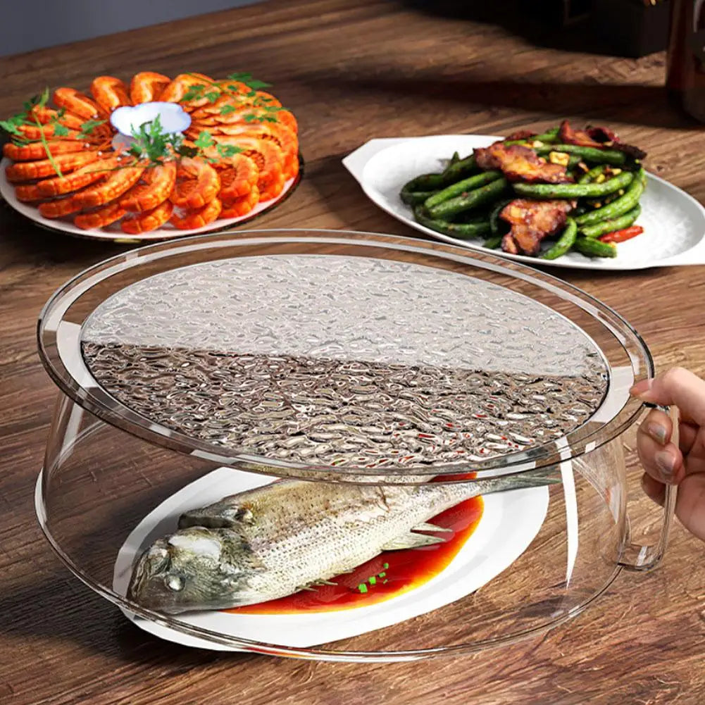 Clear microwave splatter guard with a heat-resistant handle placed over a fish on a plate.