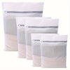 A set of white reusable mesh laundry bags with zippered tops, displayed vertically.