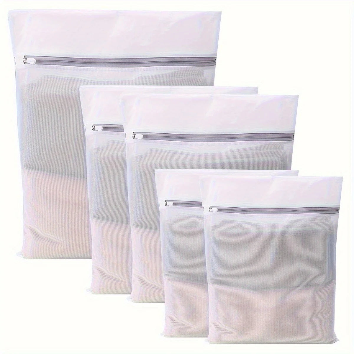 A set of white reusable mesh laundry bags with zippered tops, displayed vertically.