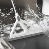 A white silicone window and surface cleaner is shown with water droplets on a dark surface.