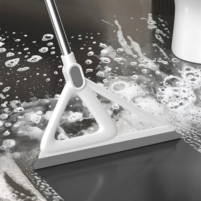 A white silicone window and surface cleaner is shown with water droplets on a dark surface.