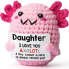 Handmade pink crochet axolotl figurine with black eyes and smiling mouth