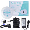 A white ionic foot spa bath massager device with a black adapter and power cord shown next to its packaging.