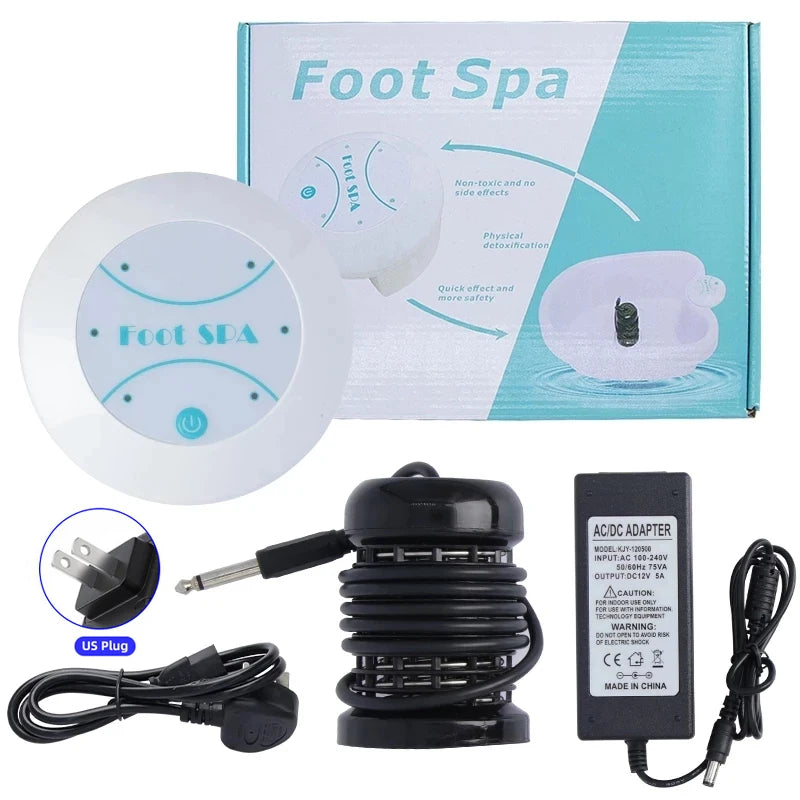 A white ionic foot spa bath massager device with a black adapter and power cord shown next to its packaging.