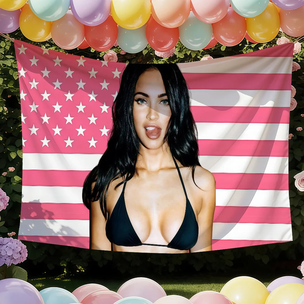 A woman wearing a black top posing in front of a pink and white American flag banner with stars.