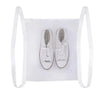 White mesh bag with two white sneakers inside, used for portable shoe washing.