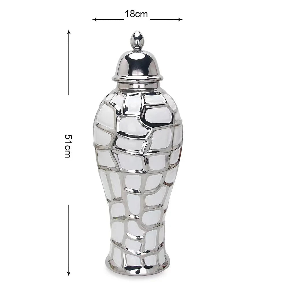 Silver ceramic flower vase shaped like a stylized, textured gourd with a lid.