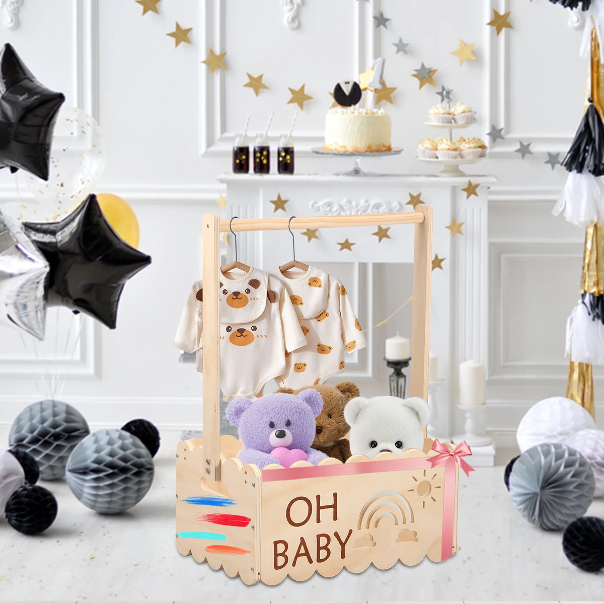 A wooden storage basket shaped like a rainbow and clouds with a mirror frame and teddy bear clothing displayed inside.