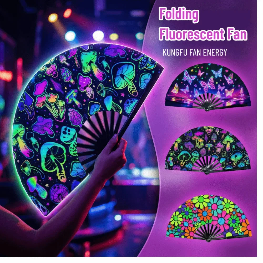 A hand holding a folding fluorescent fan displaying various glowing fungi and butterfly patterns.