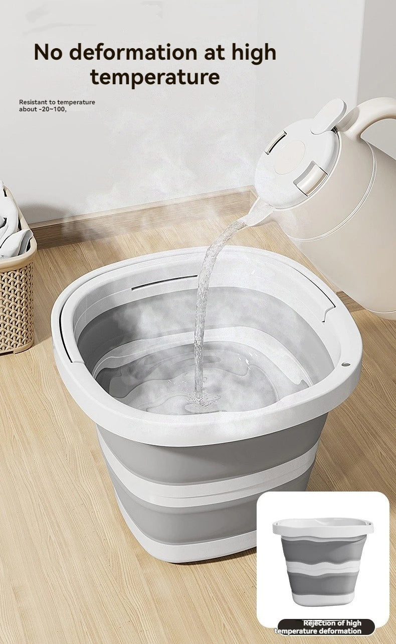 A white foldable plastic bucket with an arc handle is shown pouring water into a basin, demonstrating resistance to high temp
