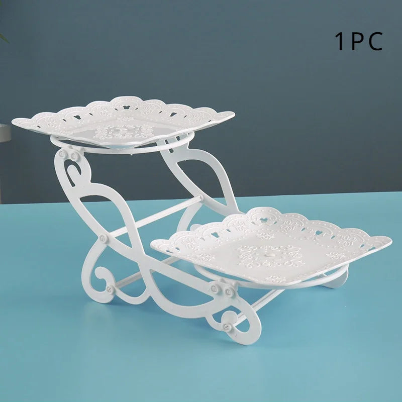 White plastic multi-use dessert stand with two tiered trays for fruit and candy