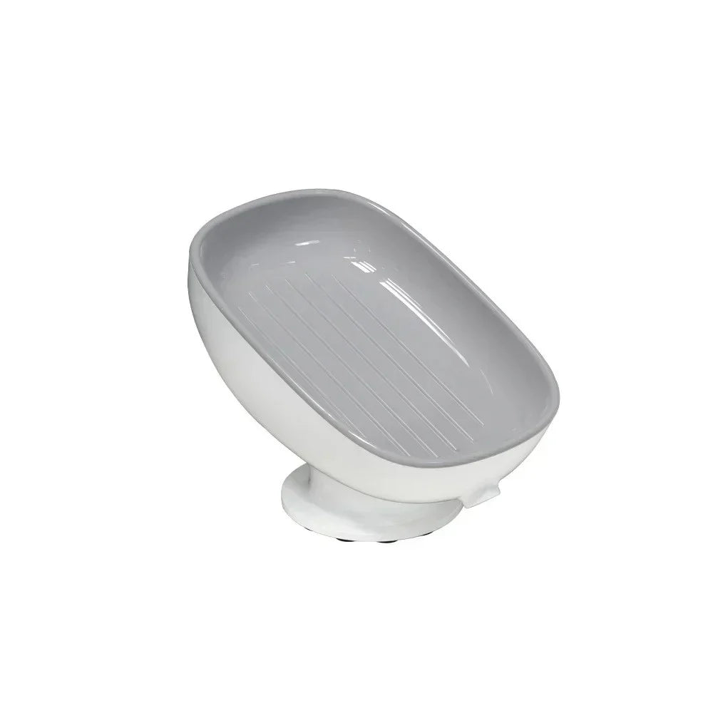 A white suction cup soap dish with built-in drainage.