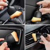 A set of black cleaning brushes with light wood accents shown in various angles for multi-surface cleaning.